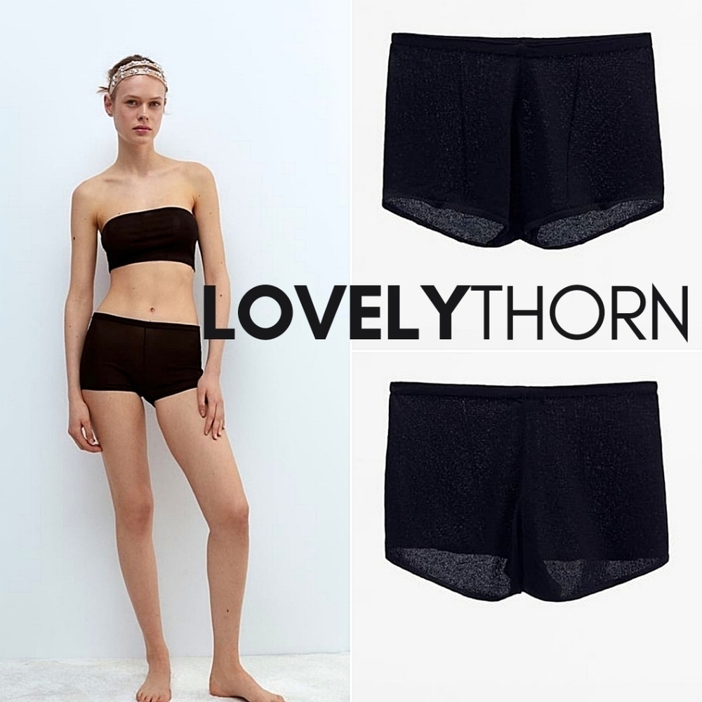 ZARA // black slightly frilled hem high elastic waist knit shorts